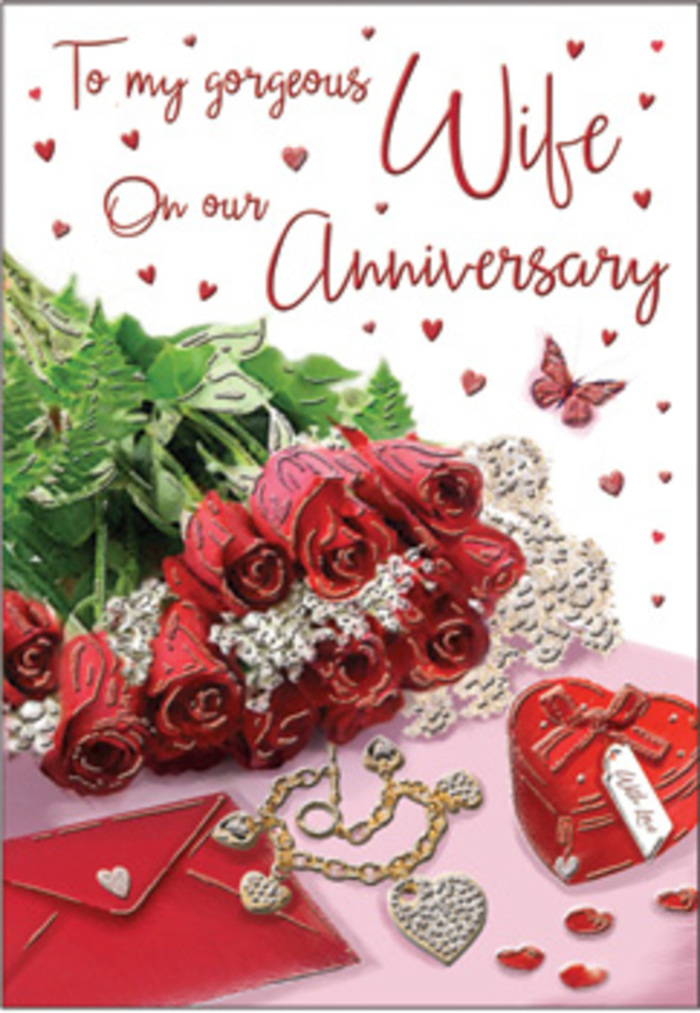 A richly emotive anniversary vignette is captured in this card, where a bouquet of classic red roses commands the viewer's attention much like a showpiece arrangement in the window of Flowers Old Ford. Each rose is fully opened, its petals lush and generously layered, the deep red tones softened by subtle highlights that suggest natural daylight filtering in from the streets around Old Ford Road. Interwoven with the blooms are sprigs of verdant greenery, enhancing the sense of abundance and echoing the seasonal foliage you might see in nearby Victoria Park. Surrounding the central flowers, delicate heart patterns and fine lace-like details create a romantic frame, their pale tones and intricate textures adding softness and grace. Resting nearby are small yet meaningful objects: a coordinated jewellery set with warm metallic glimmers, and a vivid red gift box that seems to hold some carefully chosen keepsake, its smooth surface reflecting the surrounding colour. The textures throughout the scene feel almost tangible-silky ribbon, velvet-soft petals, smooth jewellery, and gently sheened paper-inviting the imagination to reach out and touch. An elegantly scripted message winds its way through the design, visually tying together the flowers and the tokens of love, much like a ribbon binding a bouquet prepared for same-day delivery across Old Ford and Bow. The atmosphere is unmistakably romantic, but also calm and comforting, like an embrace shared at the end of a familiar walk along the canal. This card's composition speaks to anniversaries marked not just by grand gestures, but by the quieter, lasting affection that grows with time and shared history.