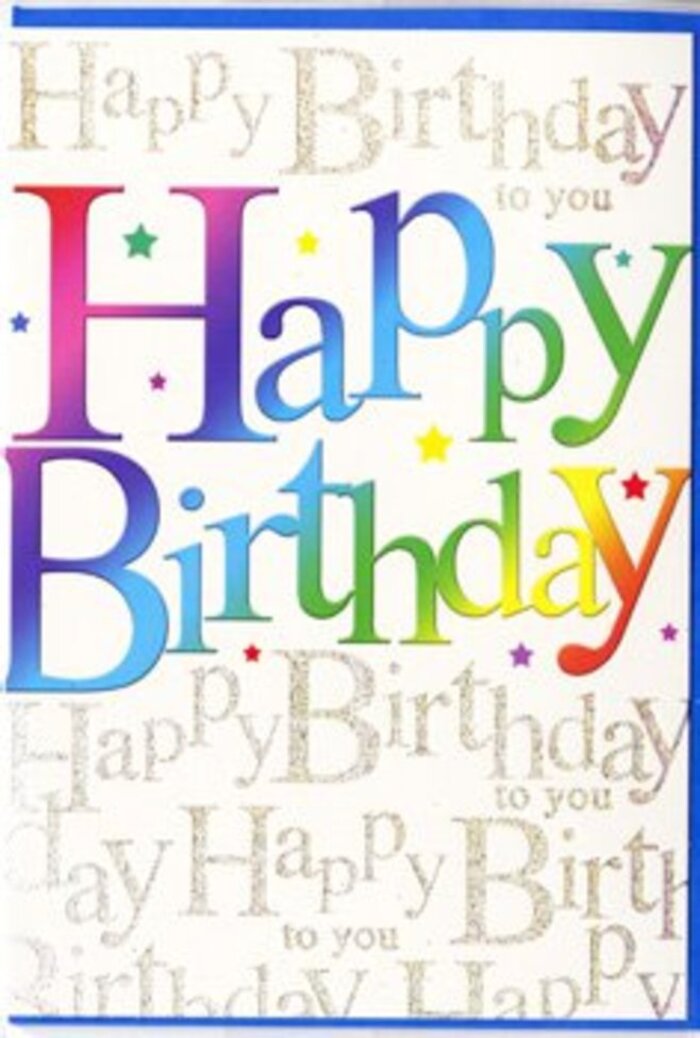 The birthday card in the image is designed with a sense of modern festivity that would sit perfectly on a windowsill overlooking the rooftops around Old Ford. Dominating the front is the cheerful phrase Happy Birthday, spelled out in bold, generously spaced letters that fill the centre of the card from edge to edge. Each letter is flooded with an ombré wash of colour, transitioning gracefully from lush crimson at one end of the word through rose, tangerine, and golden yellow, into fresh meadow green, clear teal, and finally a soothing periwinkle blue. The hues merge into one another like the gradual shift of sky colour over the canal at dusk, giving the design a feeling of movement and depth. Soft, understated shadows curve beneath the strokes of each letter, suggesting a touch of embossing and making the type feel almost touchable. Surrounding this vivid text is a sophisticated, layered background. Against a warm, creamy base, lines of cursive script repeat the phrase Happy Birthday to you in delicate metallic gold, the lettering flowing in smooth, looping rows. The shimmer of the ink is subtle, more of a gentle glow than a bright sparkle, reminiscent of fairy lights strung above a small gathering near Old Ford Lock. Scattered lightly across the background, tiny flecks and speckles provide just a hint of confetti, reinforcing the celebratory mood while keeping the composition clean and elegant. The overall effect is one of thoughtful joyfulness, the sort of card a local florist at Flowers Old Ford might choose to accompany a vibrant birthday bouquet being delivered across Old Ford, Hackney Wick, or Mile End, when you want to send wishes that feel bright, warm, and genuinely personal.