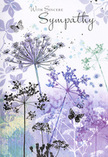 This sympathy card unfolds a quiet, poetic landscape that feels at home in the softer corners of Old Ford, where greenery and water meet around the edges of Victoria Park. At its centre, a cluster of tall, fine stems reaches upwards, each carrying an umbelliferous flower head that spreads into delicate patterns of tiny dots and branching lines. The colours are cool and calming-lavenders, gentle blues, and dusty greens brushed in translucent layers that let the white of the card show through, creating a sense of light within the image itself. The background is a loose, watery blend of muted purples and grey-blues, as if the sky and distant foliage had been gently blurred by morning mist along the towpath. The composition is airy, with generous open space between the stems so that nothing feels crowded or heavy. Among the flowers, soft, transparent butterflies hover in mid-air, their shapes only lightly suggested, like fleeting moments of comfort that visit unannounced. The lighting throughout the illustration is gentle and even, evoking a calm, clouded day rather than bright sunshine, which helps to convey a mood of reflection and quiet sympathy. Above this dreamlike meadow, the words conveying condolence are written in an elegant script, sitting lightly on the page and blending harmoniously with the art. Speaking as a florist who often prepares delicate, meadow-style arrangements for bereavements around Old Ford, Bow, and nearby streets, this card feels like a visual companion to those designs-cool yet reassuring, respectfully understated, and shaped to offer solace and a sense of shared understanding when words alone are not enough.